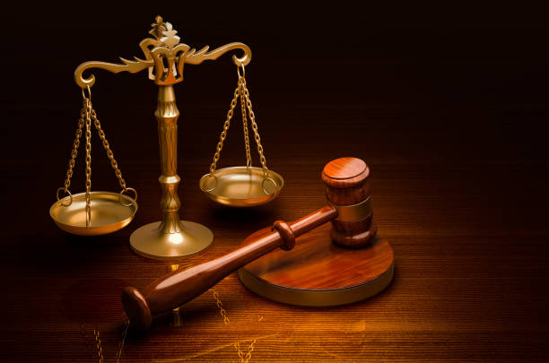 scales of justice and wooden gavel on the desk, 3d rendering
